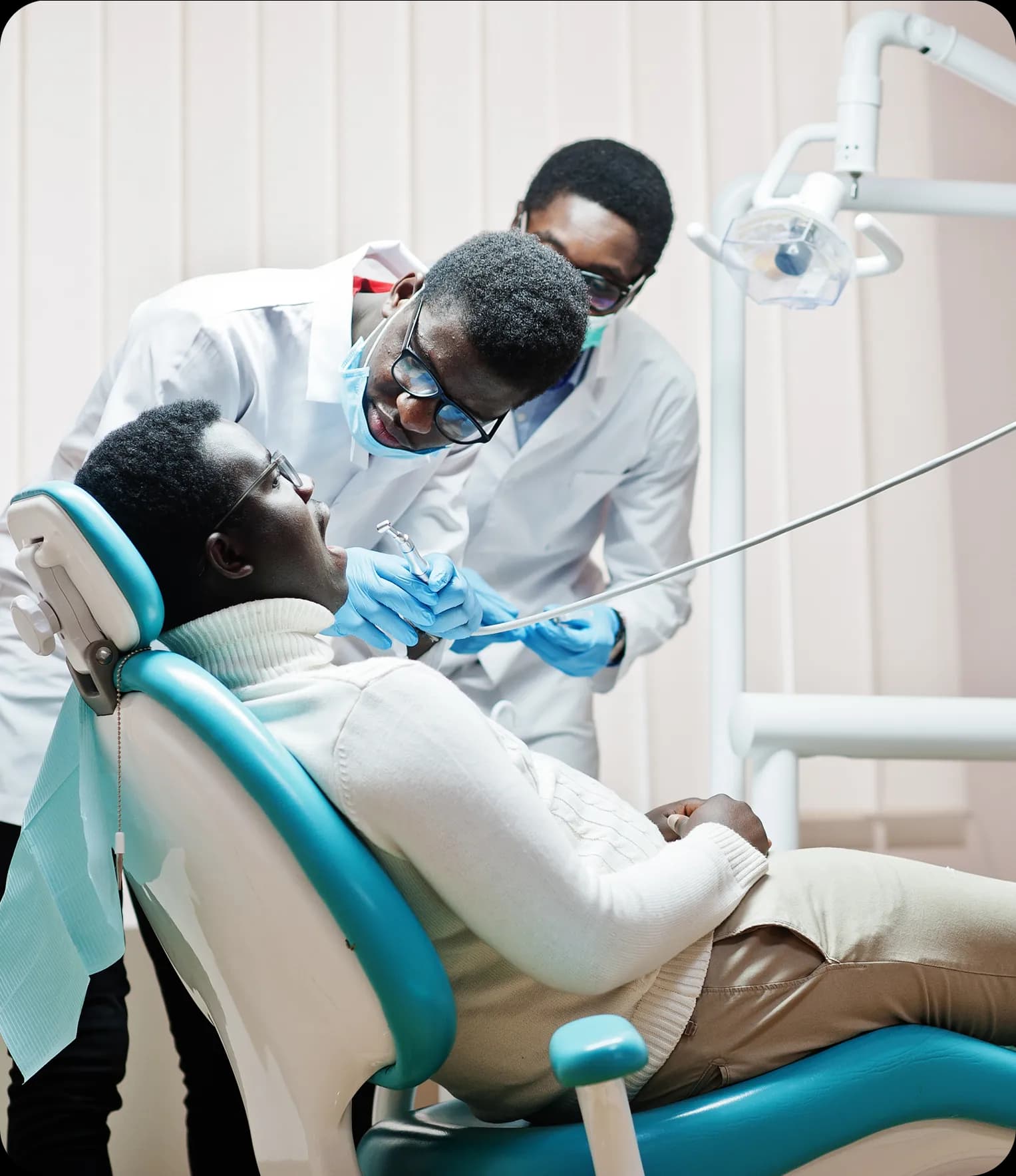 Dentist treating patient in dental chair