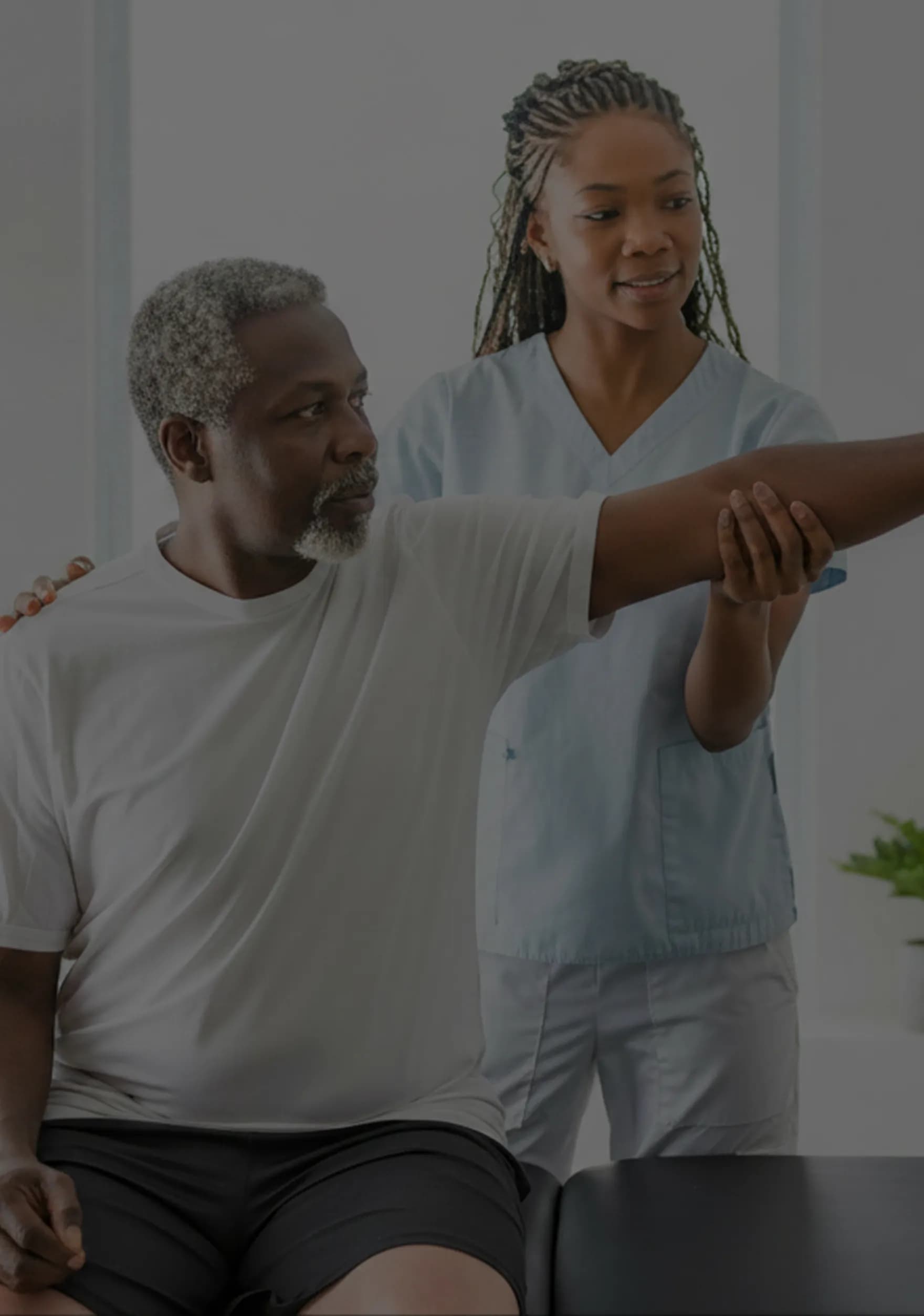 Physiotherapist helping patient with rehabilitation exercise